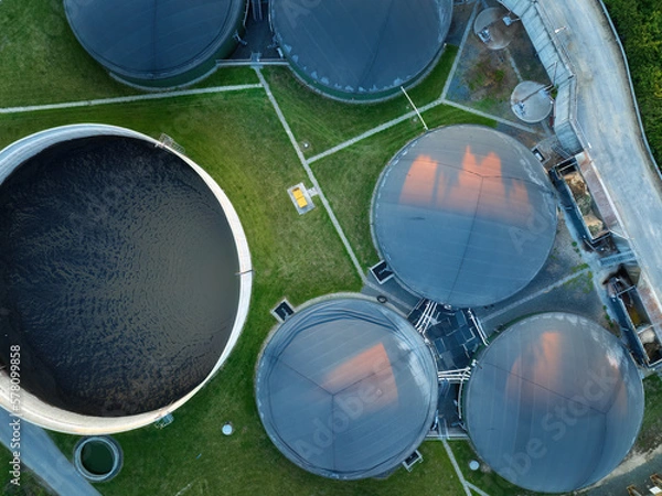 Fototapeta 
Vertical view of the process components, fermenters and biogas storage tanks of the agricultural biogas plant. Use of biogas in cogeneration units for electricity and heat production.