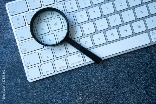 Obraz Magnifying glass and keyboard. SEO concept.