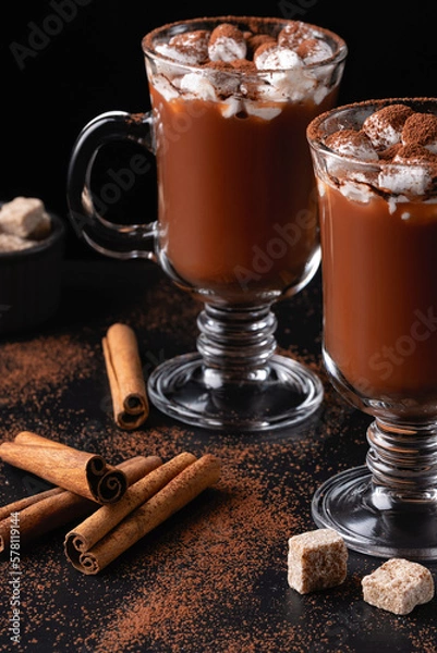 Fototapeta Two cups of hot chocolate, cocoa or warm drink with marshmallows on dark background