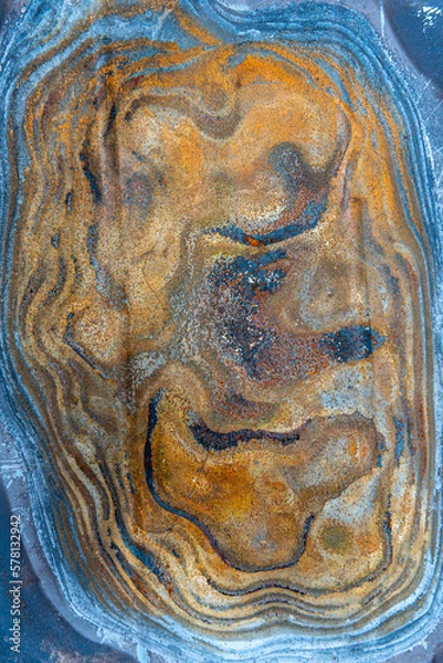 Fototapeta multi-colored discoloration on a piece of metal