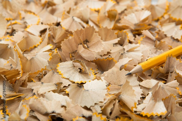 Fototapeta Pencils being sharpened  and collection of wood shavings.
