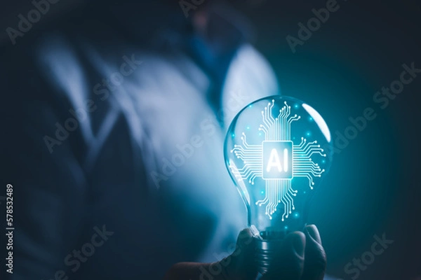 Obraz hand holding a light bulb. artificial intelligence or AI of future innovation technology concept, applying technology to business in the digital age. empowering global business AI.