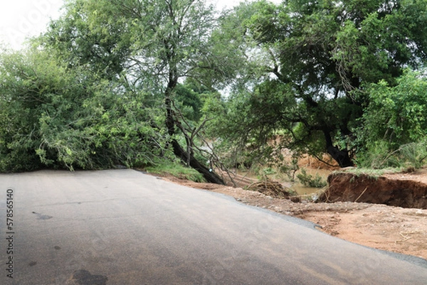 Fototapeta Kruger National Park, South Africa: flood damage to the roads infrastructure. The parks workers were within a few days working on repairs