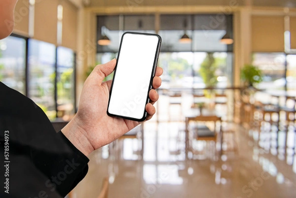 Fototapeta Man using smartphone at abstract blurred