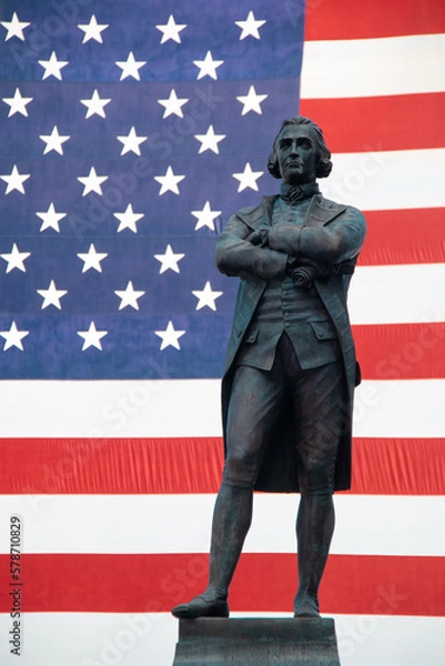 Fototapeta Samuel Adams Statue in from of United States Flag in Boston. 