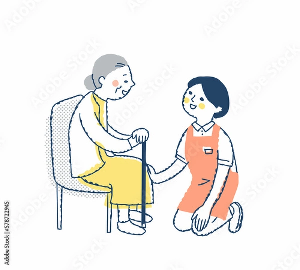 Fototapeta シニア女性としゃがんで話す介護スタッフ