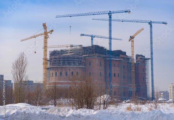 Fototapeta People's Salvation Cathedral (Catedrala Mantuirii Neamului), the biggest christian orthodox cathedral under construction in Bucharest, Romania, in a frozon and snowy winter day