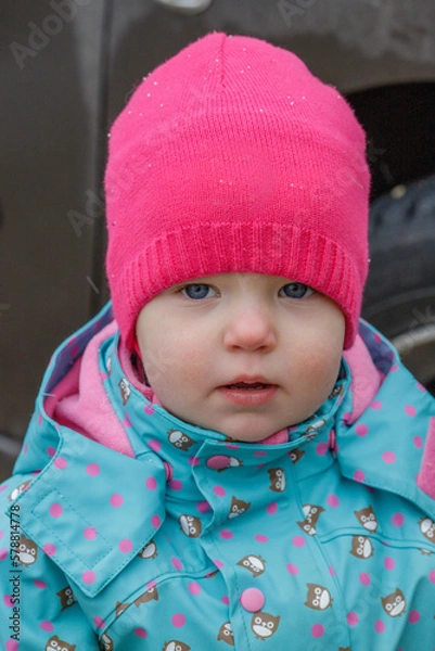 Obraz Portrait of a little girl in a red hat