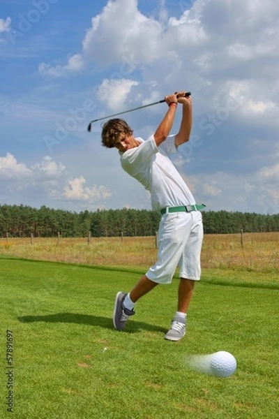 Fototapeta Golf, golfer striking the ball