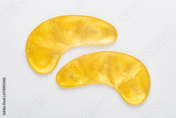 Obraz Gold hydrogel eye patches on white background.