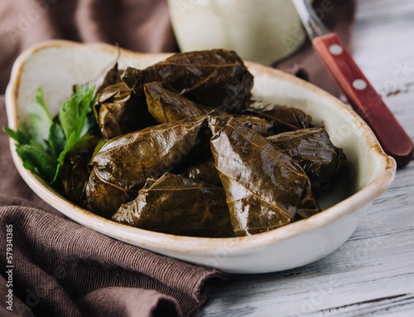 Fototapeta Dolma cabbage rolls grape leaves with filling