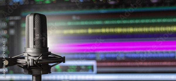 Fototapeta Professional vocal microphone with audio editing software background and copy space for podcast or radio broadcast banner