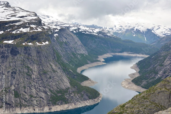 Obraz River in Norway going through icy mountain peaks on the Troll tunga