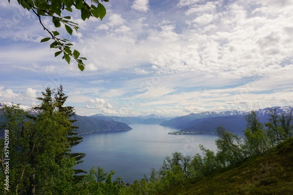 Obraz Scenic lake surrounded by mountains and forest on a sunny day