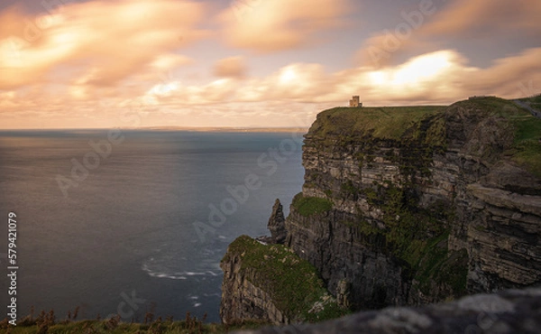Obraz Stone Cliffs in Ireland on a cloudy day with a beautiful sunset by the ocean in spring