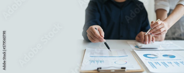 Fototapeta Business sales consultant discussing in data documents at modern office.