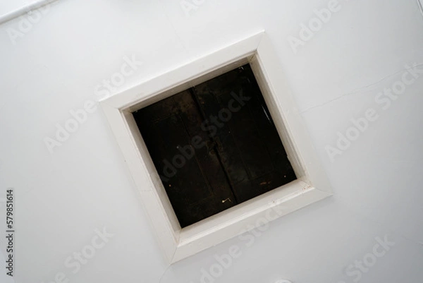 Fototapeta Looking up at a loft hatch