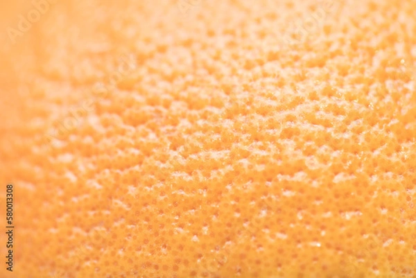 Obraz Defocused and blurred grapefruit orange skin macroclose up with pores
