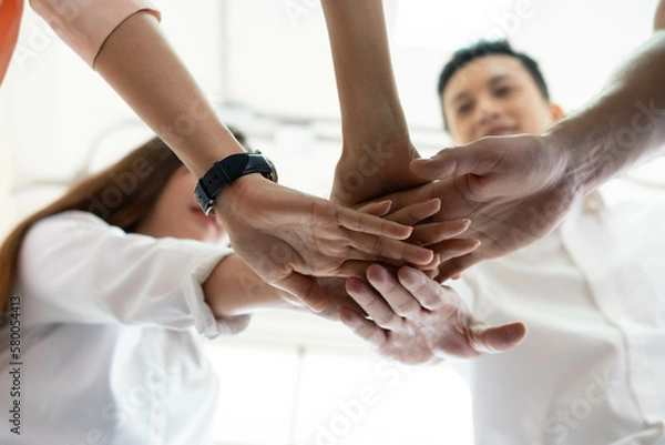 Fototapeta holding hands for strong teamwork and volunteer to public service action, people joined hand in hands partner agreement for great support great performance at business office background together.
