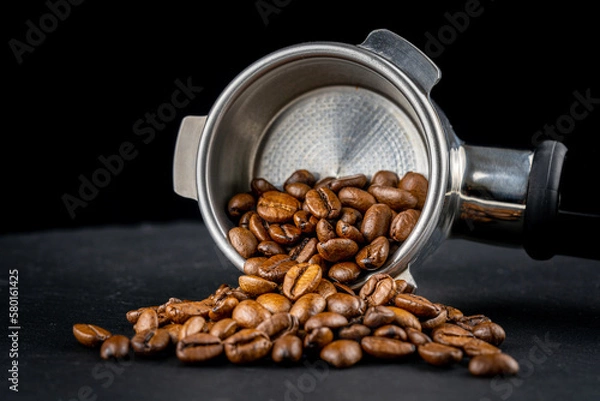 Obraz Porta filter with black shiny Handle. view with coffee beans. Barman tool for making an espresso with the right pressure.