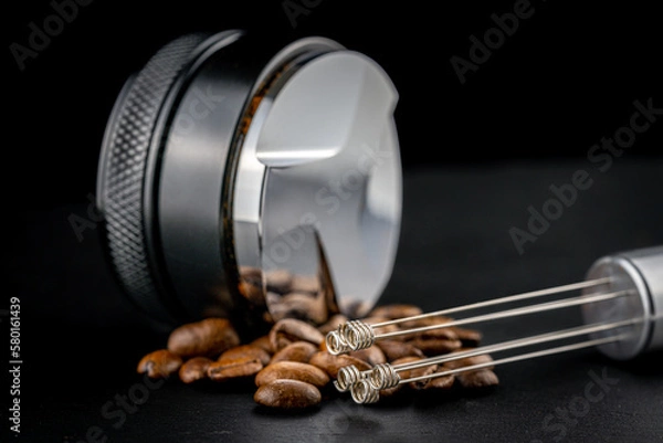 Obraz Coffee leveler with black matte texture and shiny bottom. Barista tool for leveling ground coffee in the porta filter before extraction.