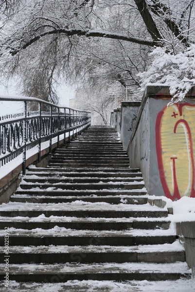 Fototapeta The urban stone stairs leading up with graffiti elements