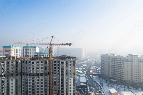 Fototapeta Aerial shot of under constructing apartment house