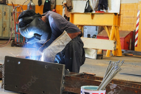 Fototapeta worker sitting welding