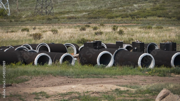 Obraz Concrete sewer well. Installing underground storm systems of water main and sanitary sewer.