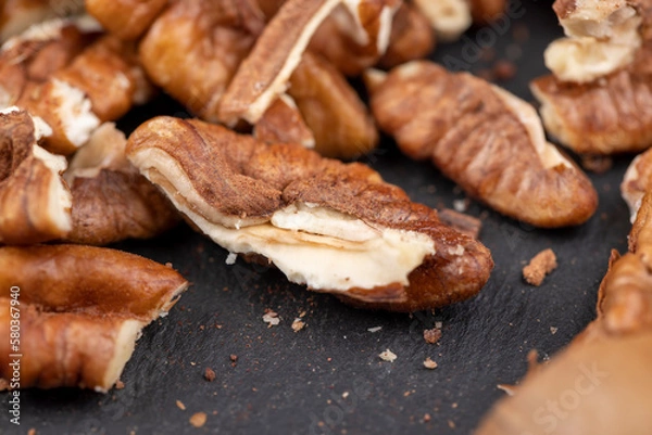 Fototapeta fresh crop of pecans on the surface