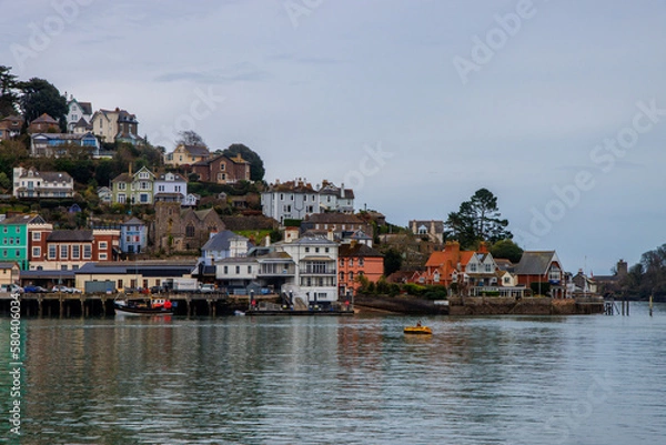 Fototapeta Kingswear - coastal town in Devon with vibrant and colourful buildings. View from Dartmouth side of the river 