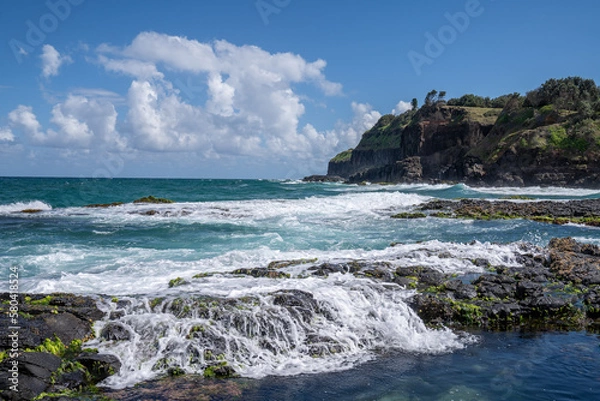 Fototapeta waves crashing on rocks