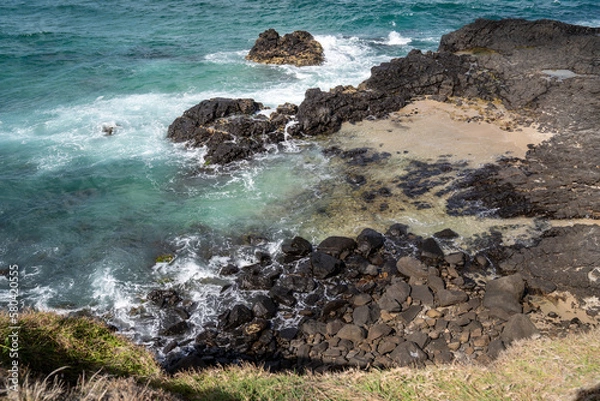 Fototapeta waves crashing on rocks