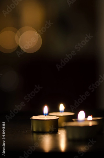 Fototapeta Small candles with dark background