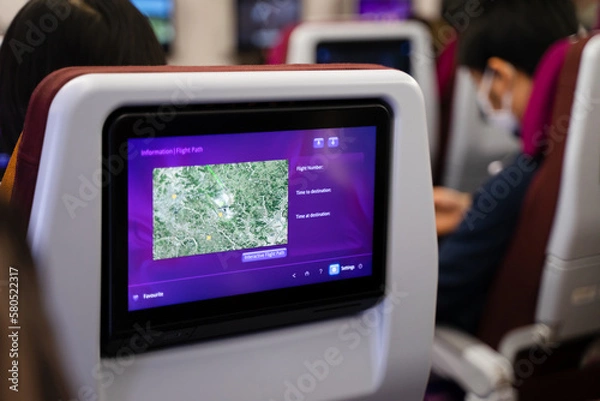 Fototapeta LCD display. Colorful flight maps on-screen inside passenger planes, a quick and convenient travel check is a fun and informative way