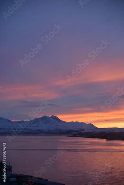 Fototapeta Incredible sunset in winter in tromsø, norway. Very beautiful colors of the sky, just like in the movie