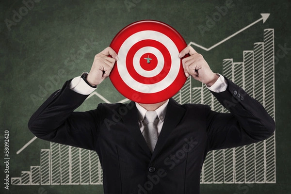 Fototapeta Businessman with a dartboard