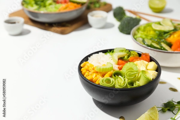 Fototapeta Bowls with tasty and nutritious food, space for text