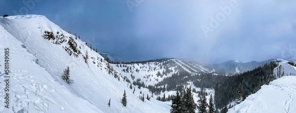 Fototapeta Panorama of snowy mountains of Park City ski resort as seen from the top of McConkey's hike.