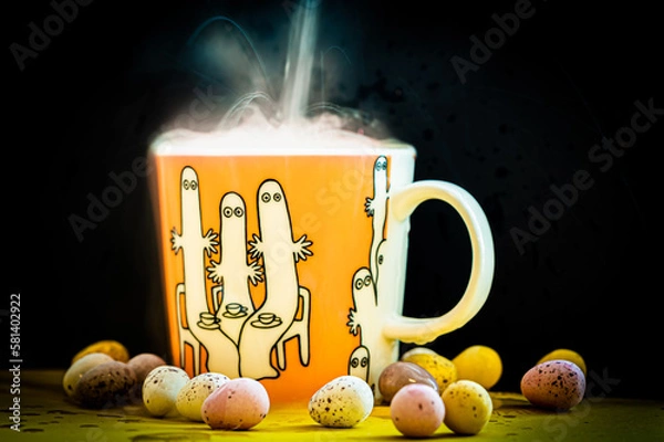 Fototapeta cup of coffee with tea with steam and easter eggs