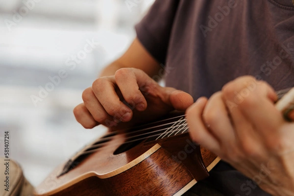Obraz man playing ukulele, close up