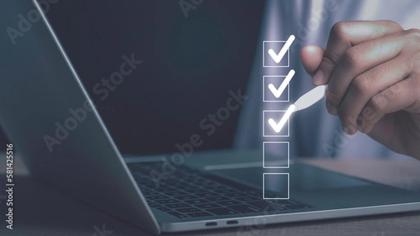 Fototapeta Digital work checklist or electronic smart daily checklist concept. Check mark on virtual screen display for personal working in office Document Management System and process automation.