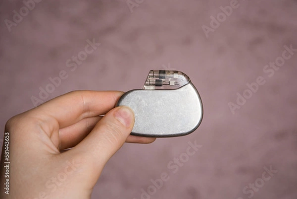 Obraz medical pacemaker hold in hand