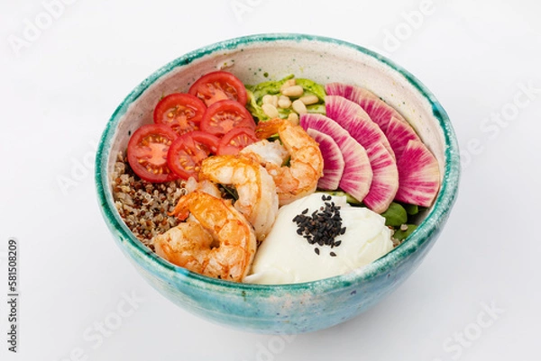 Fototapeta Poke bowl with shrimp, quinoa, poached egg, celery, cherry tomatoes, herbs, pine nuts and sesame seeds. Green round bowl on a white background. Close up 3/4