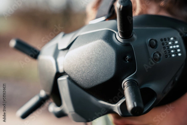 Fototapeta close up of a person using the fpv goggles for a dji drone
