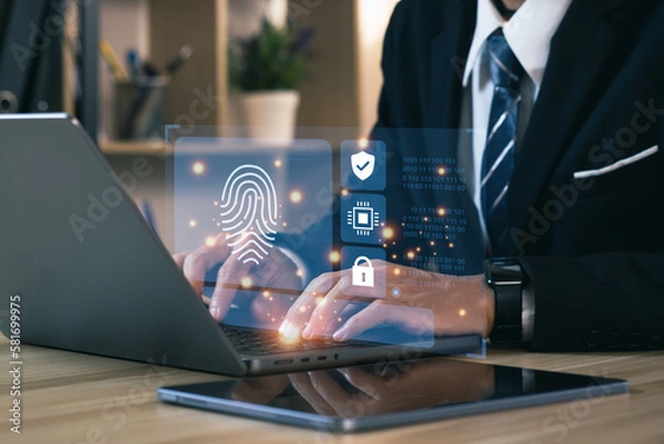 Obraz Businessmen using a computer to cyber security digital technology, business people use fingerprints to access personal cybersecurity, keeping users' personal information safe. Concept of surveillance.