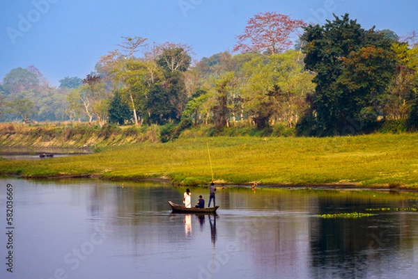 Obraz Autumn landscape with a boat. Majuli is the world's most oversized river island on the bank of the Brahmaputra River, Assam.