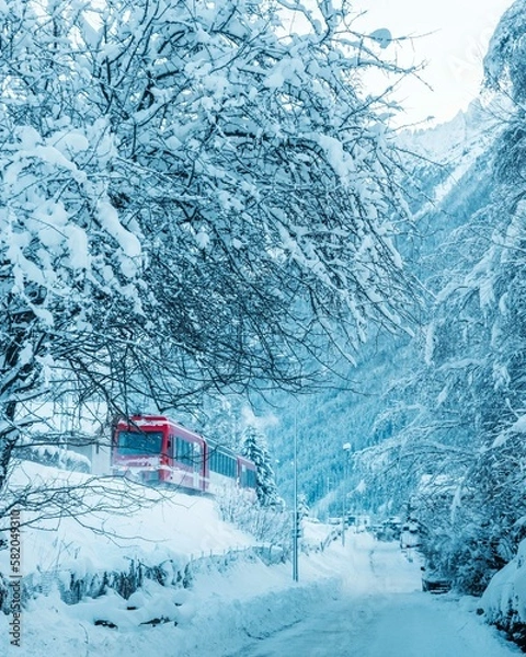 Fototapeta Red Train in Snowy Mountains in Chamonix, France