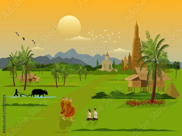 Obraz A Buddhist monk is walking on a road with men and women sitting in worship. Farmers plowing fields with buffaloes with pagodas and the morning sky in the background.