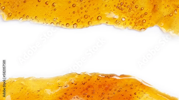 Fototapeta cannabis golden shatter resin extract and white background with copy space  place for text